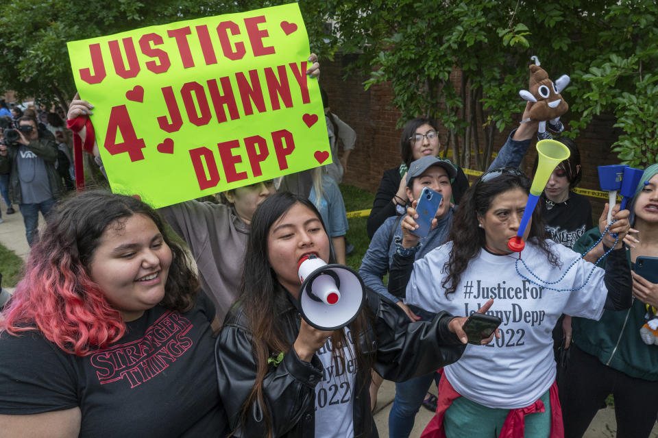 Supporters of actor Johnny Depp rally outside of Fairfax County Courthouse as a jury is scheduled to hear closing arguments in Johnny Depp's high-profile libel lawsuit against ex-wife Amber Heard in Fairfax, Va., on Friday, May 27, 2022.(AP Photo/Craig Hudson)