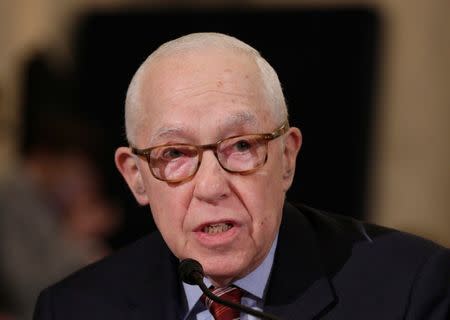 FILE PHOTO: Former U.S. attorney general Michael Mukasey speaks during the second day of confirmation hearings on Senator Jeff Sessions (R-AL) nomination to be U.S. attorney general in Washington, U.S., January 11, 2017. REUTERS/Joshua Roberts