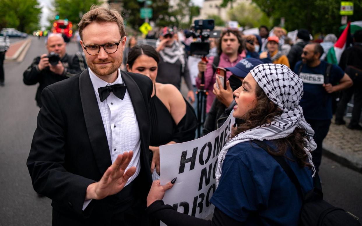 Demonstrators try to block arriving guests