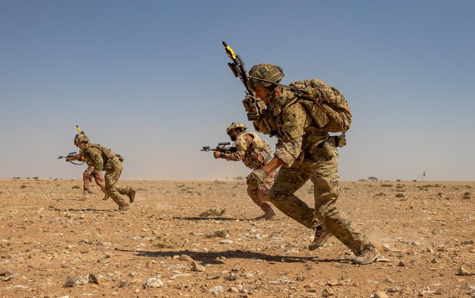 A 1 Royal Irish Regiment Section Commander leads an attack on an enemy position along side soldiers from the Royal Army of Oman - British Army