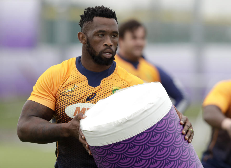 South Africa's captain Siya Kolisi holds a tackle bag during a training session in Tokyo, Japan, Thursday, Oct. 17, 2019. South Africa play Japan in a Rugby World Cup quarterfinal on Sunday Oct 20. (AP Photo/Mark Baker)