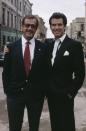 <p>Pierce Brosnan poses with Roger Moore on the set of <em>GoldenEye</em>.</p>