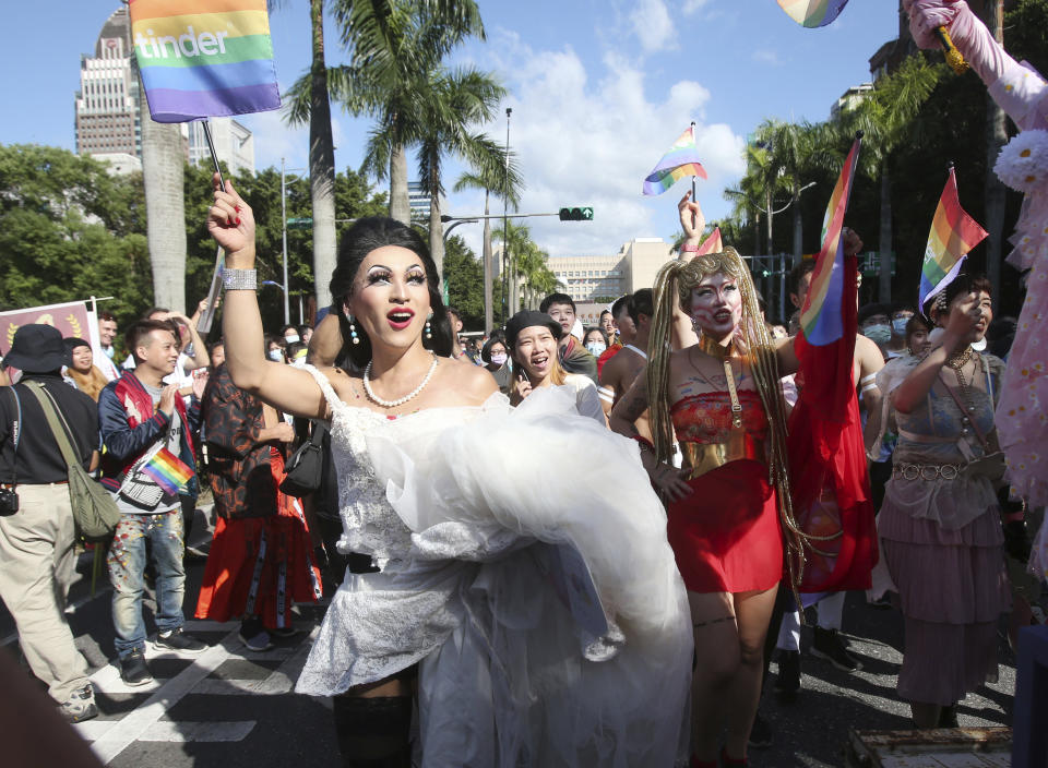 Participants march through a street during a pride parade in Taipei, Taiwan, Saturday, Oct. 31, 2020. (AP Photo/Chiang Ying-ying)