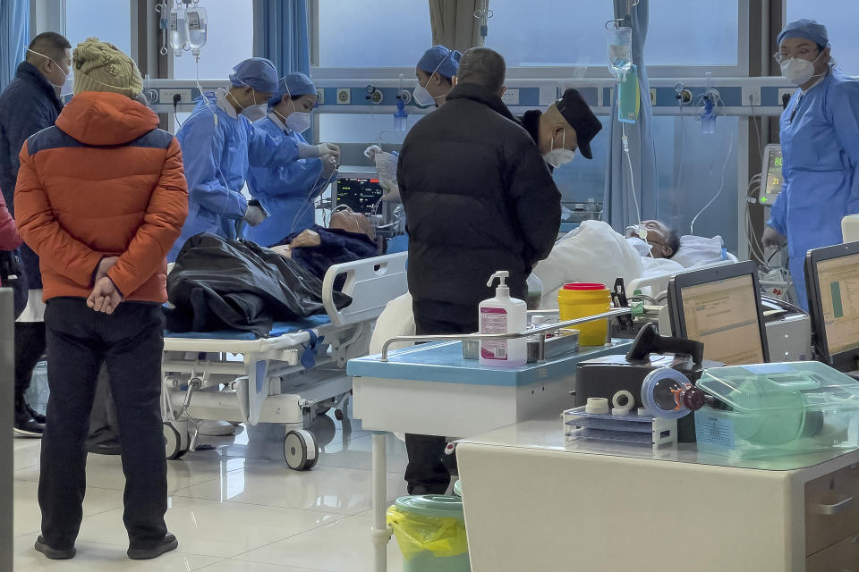 Medical workers check on an elderly patient arrives to an emergency hall in a hospital in Beijing, Saturday, Jan. 7, 2023. China has suspended or closed the social media accounts of more than 1,000 critics of the government's policies on the COVID-19 outbreak, as the country moves to further open up. (AP Photo/Andy Wong)