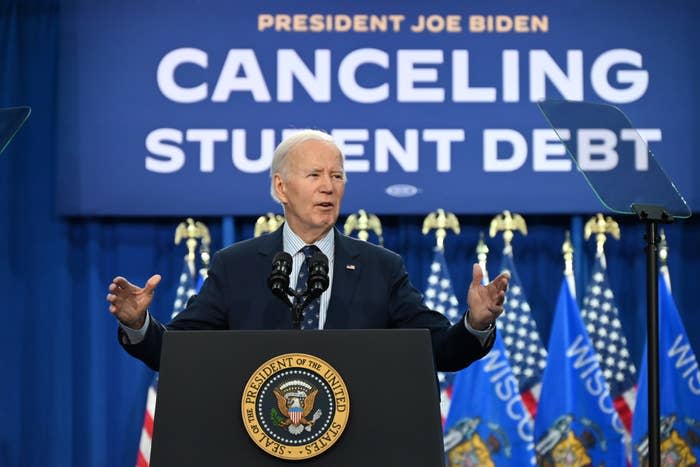 President at a podium with "CANCELING STUDENT DEBT" sign