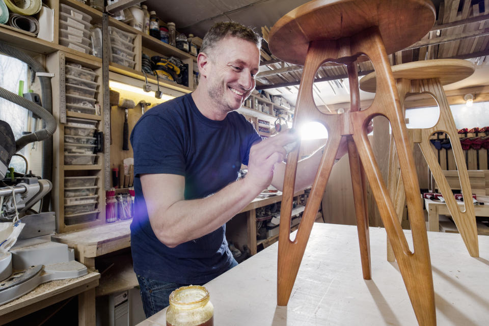 a man making a piece of furniture