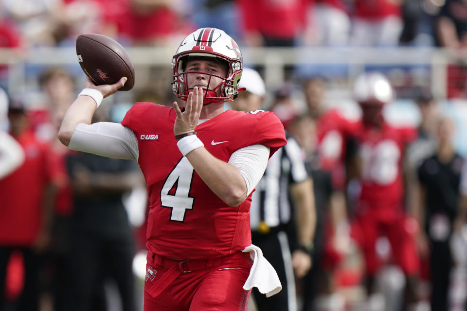 Western Kentucky quarterback Bailey Zappe throws a touchdown pass, his sixth of the game, during the second half of the Boca Bowl NCAA college football game against Appalachian State, Saturday, Dec. 18, 2021 in Boca Raton, Fla. Zappe threw for 422 yards and six touchdowns as the Western Kentucky beat Appalachian State 59-38. (AP Photo/Wilfredo Lee)