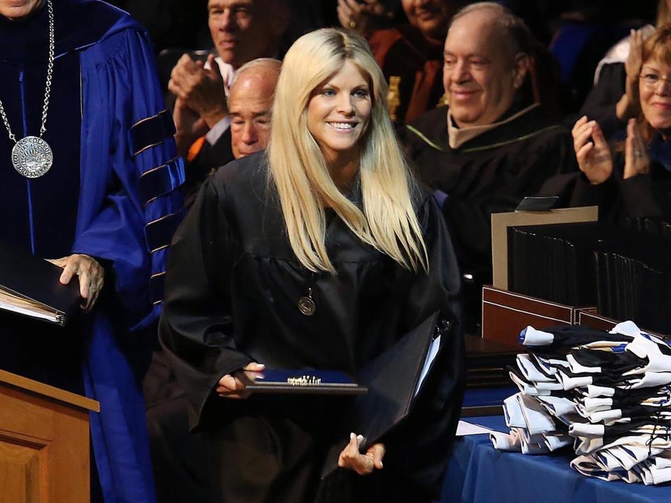 Elin Nordegren walks off the stage after speaking during commencement ceremonies at Rollins College in Winter Park, Fla., Saturday, May 10, 2014