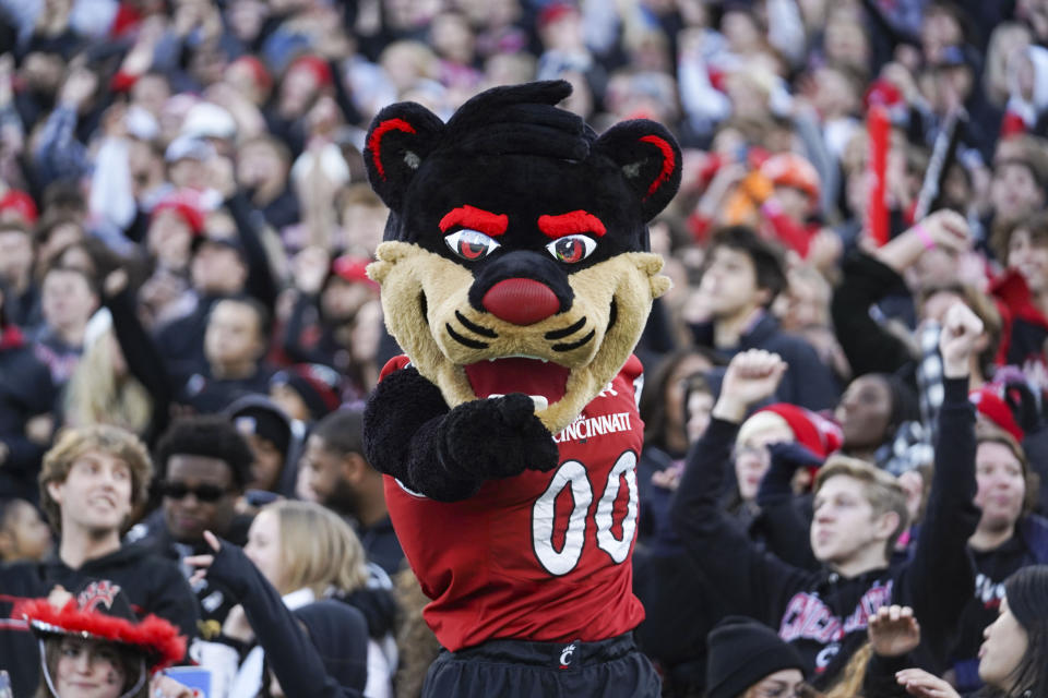 The Cincinnati Bearcat mascot stands in front of the student section during the first half of the American Athletic Conference championship NCAA college football game against Houston Saturday, Dec. 4, 2021, in Cincinnati. (AP Photo/Jeff Dean)