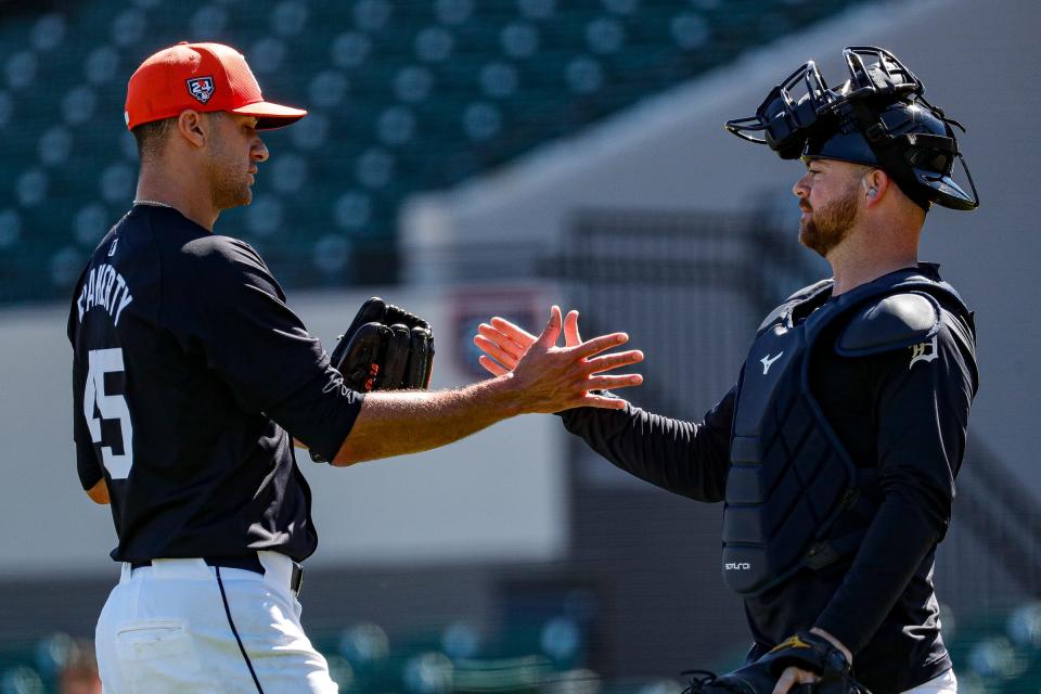 Detroit Tigers pitcher Jack Flaherty shakes hands with catcher Jake Rogers during spring training at Joker Marchant Stadium in Lakeland, Florida, on Thursday, Feb. 22, 2024.