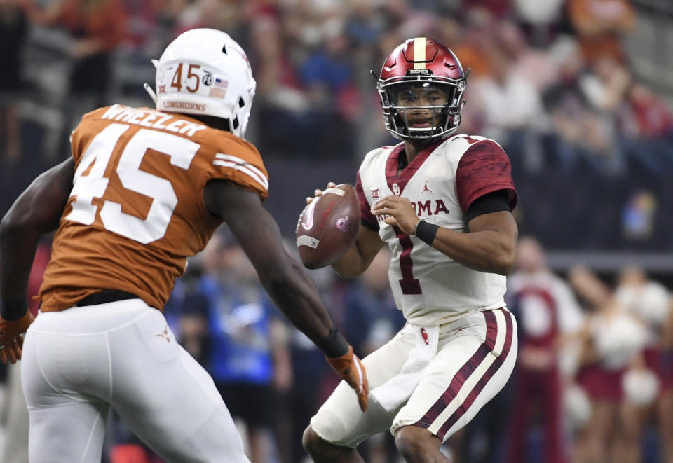 Did Oklahoma quarterback Kyler Murray (1) do enough in the Big 12 title game to pass Tua Tagovailoa on Heisman ballots? (AP)