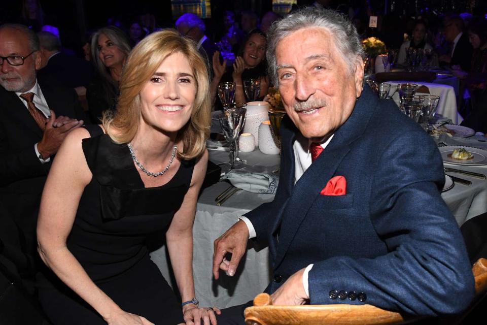 <p>Kevin Mazur/Getty</p> Tony Bennett poses with his wife Susan at the Statue Of Liberty Museum Opening Celebration on May 15, 2019