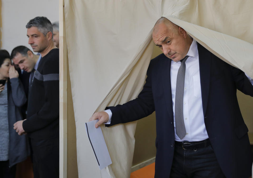 Bulgarian former Prime Minister Boiko Borisov, leader of the center-right GERB party, exits a voting cabin in Sofia, Bulgaria, Sunday, March 26, 2017. Bulgarians are heading to the polls for the third time in four years in a snap vote that could tilt the European Union's poorest member country closer to Russia as surveys put the GERB party neck-and-neck with the Socialist Party. (AP Photo/Vadim Ghirda)