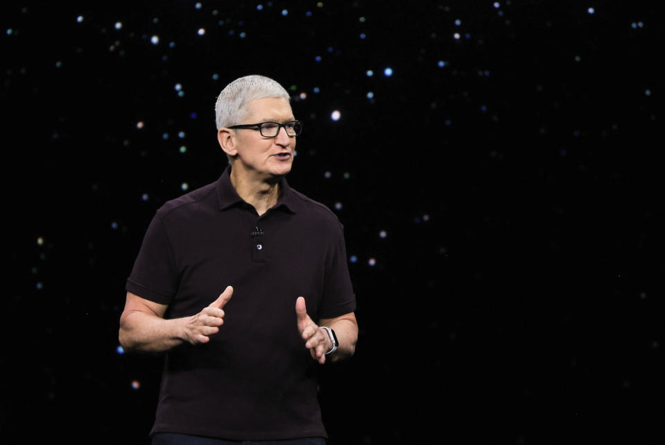 Apple CEO Tim Cook presents the new iPhone 14 at an Apple event at their headquarters in Cupertino, California, U.S. September 7, 2022. REUTERS/Carlos Barria