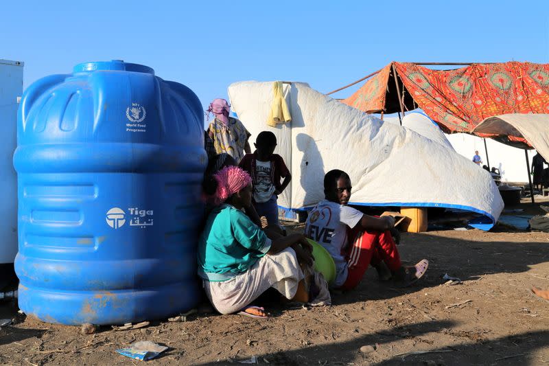 Ethiopians who fled the ongoing fighting in Tigray region, wait to be processed for emergency food and logistics support by the WFP in Hamdait village on the Sudan-Ethiopia border in eastern Kassala state