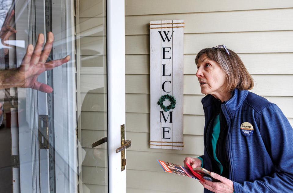 Elise Patton, first vice chair of the Sauk County Democratic Party, canvasses voters for Wisconsin Supreme Court candidate Janet Protasiewicz in April. 