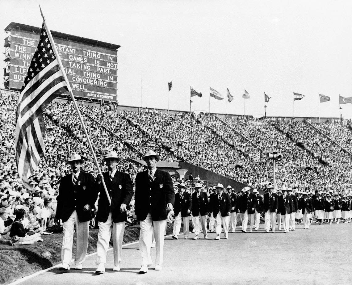 A July 29, 1948, photo of Olympians carrying the American flag in the parade of the nations at the opening of the Summer Games in London’s Wembley Stadium. Athletes bought their own uniforms, and some their own food. They stayed in private homes, schools and military barracks. If eggs appeared on the training menu, it was a cause for celebration. When London hosted the Olympics in 1948, organizers did it on the cheap, and they made no apologies about it.