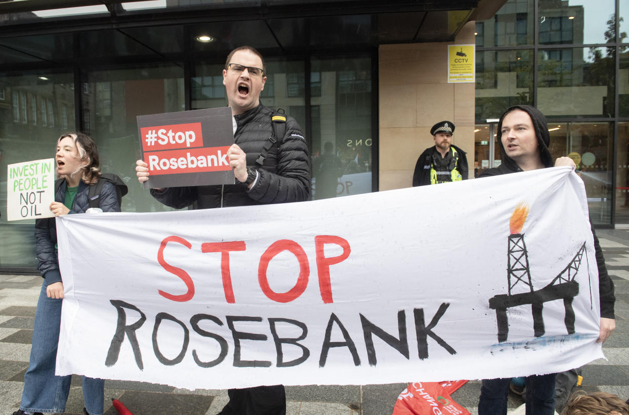 Protesters with signs reading 'Stop Rosebank'