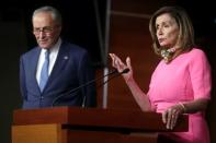 U.S. House Speaker Nancy Pelosi (D-CA), speaks next to Senate Minority Leader Chuck Schumer (D-NY), during a news conference on Capitol Hill in Washington