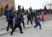 Demonstrators from rival political groups react during a rally in Bishkek