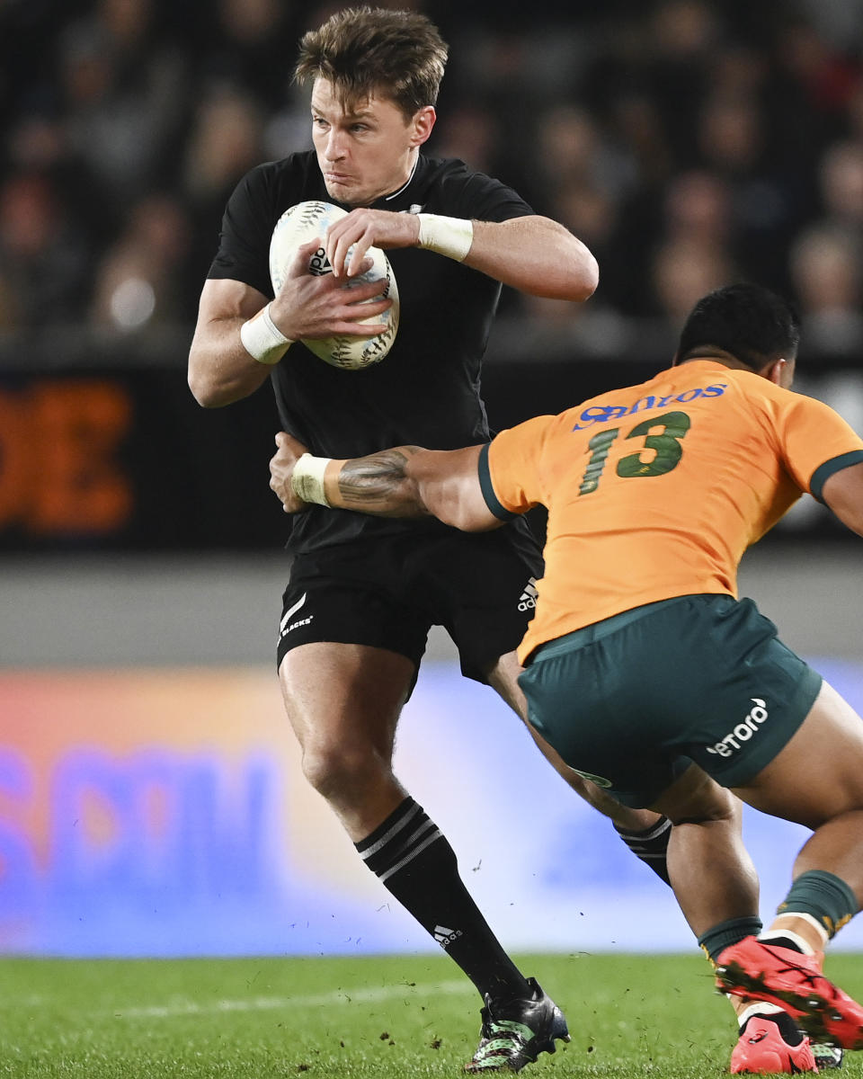 New Zealand's Beauden Barrett is tackled by Australia's Len Ikitau during the Bledisloe Cup rugby test match between the All Blacks and the Wallabies at Eden Park in Auckland, New Zealand, Saturday, Sept. 24, 2022. (Andrew Cornaga/Photosport via AP)