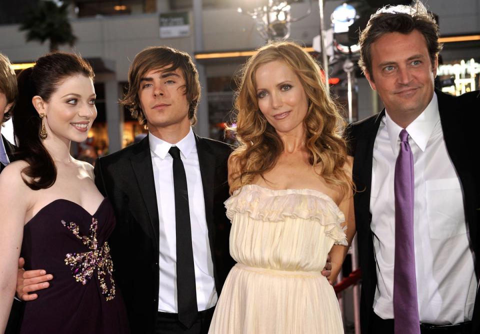 Efron (centre left) pictured with his 17 Again co-stars (L-R) Michelle Trachtenberg, Leslie Mann and Matthew Perry at the LA premiere in 2009 (Getty Images)