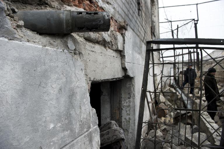 A Grad rocket is lodged in the wall of a building in Chornukhyne, east of Debaltseve, eastern Ukraine on February 28, 2015