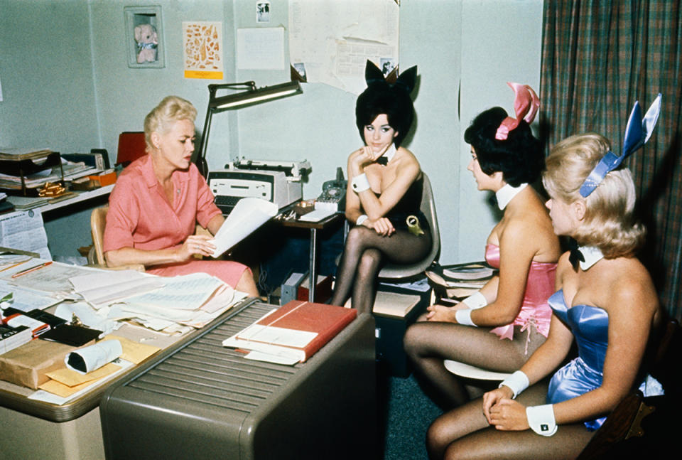 (Original Caption) At the Chicago Playboy Club, the Bunny Mother talks with some of the bunnies, (all are unidentified).
