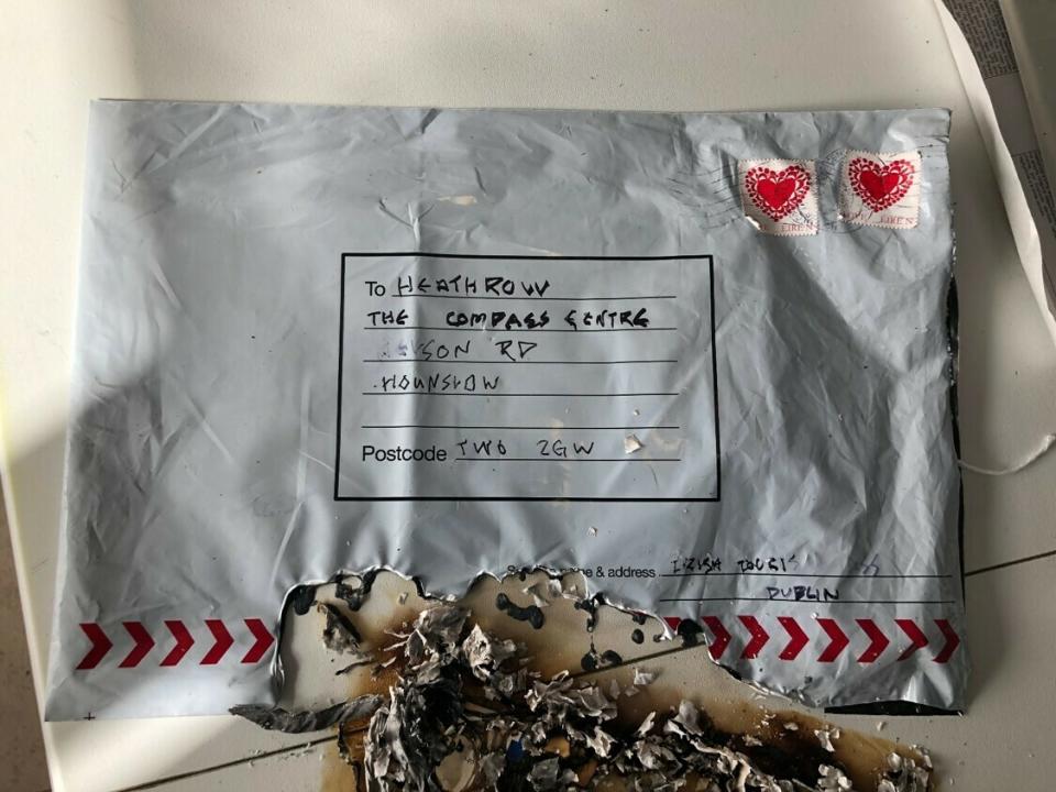 In this photo dated Tuesday March 5, 2019, issued by Britain's Metropolitan Police showing a suspect package after it ignited, sent to Heathrow airport, one of three packages being treated as a linked series by Britain’s counter-terrorism police. On Wednesday March 6, 2019, Police Scotland said officers are examining items found at the University of Glasgow and the Royal Bank of Scotland headquarters in Edinburgh, Scotland. It is not known at this time, if the incidents are linked. (Britain's Metropolitan Police via AP)