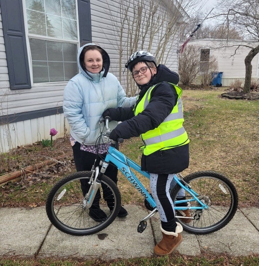 When 11-year-old Elliott Bauknecht (left) received a blue Schwinn Ranger from Charity Bicycles, it was a game changer.