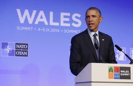 U.S. President Barack Obama holds a news conference at the conclusion of the NATO Summit at the Celtic Manor Resort in Newport, Wales September 5, 2014. REUTERS/Larry Downing