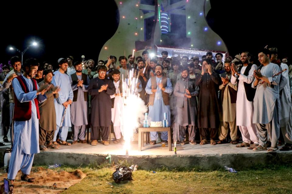 Afghanistan fans burst firecrackers in Khost to celebrate beating Australia (AFP via Getty Images)