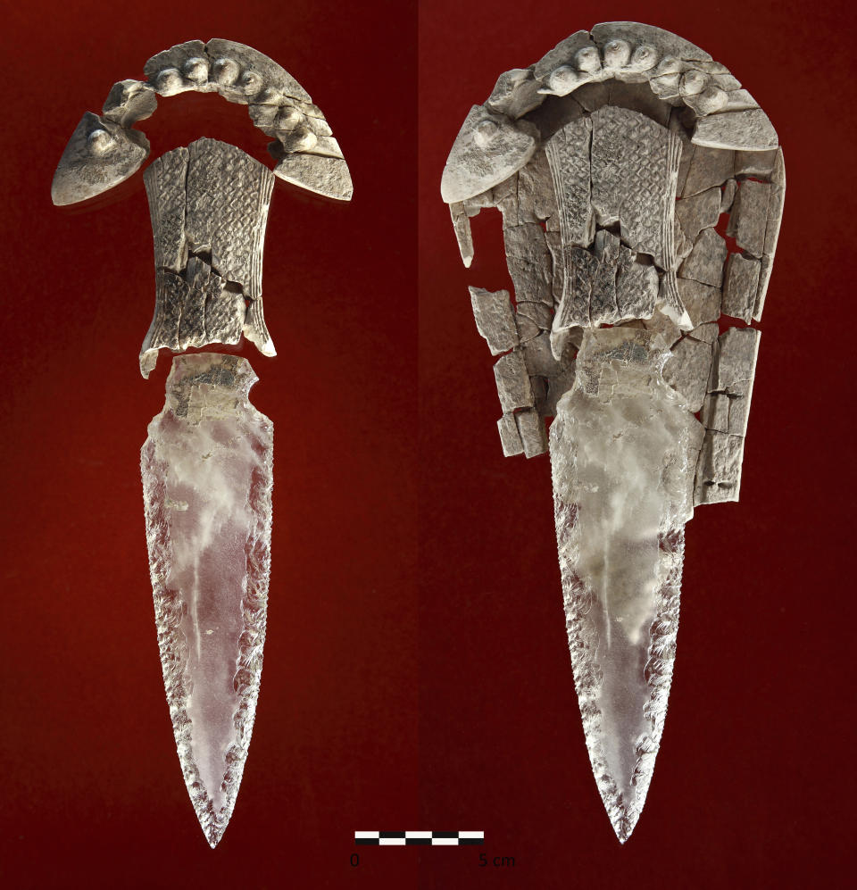 CORRECTS TO VALENCINA, NOT VALENCIA - This photo provided by the ATLAS research group of the University of Seville in July 2023 shows a rock crystal dagger with an ivory hilt and sheath discovered in a tomb in Valencina, Spain, dated between 3,200 and 2,200 years ago. When archaeologists first discovered the ornate tomb, they assumed it was for a man. But now they’ve determined the remains are those of a woman by analyzing tooth enamel, according to a study published Thursday, July 6, 2023, in the journal Scientific Reports. (Miguel Ángel Blanco de la Rubia/ATLAS - University of Seville)