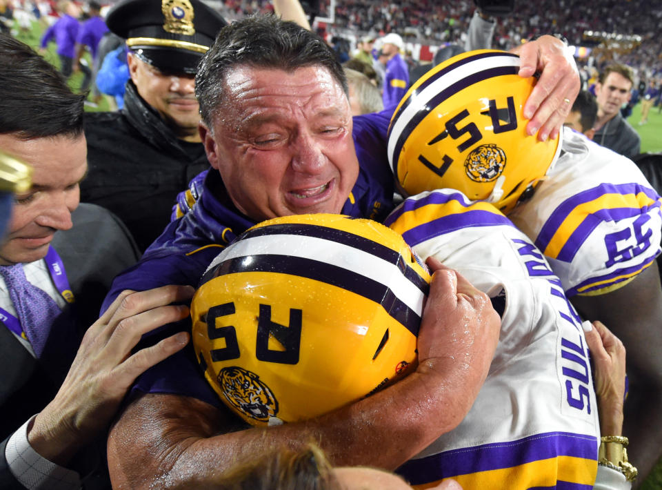 LSU Tigers head coach Ed Orgeron celebrates midfield with his players following the Tigers' 46-41 win over Alabama at Bryant-Denny Stadium. (USA Today)