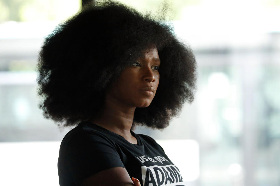 Assa Traore, wearing a shirt that reads: “Justice for Adama, without Justice you will never be in Peace,” attends an interview in Ivry-sur-Seine, on the outskirts of Paris, Wednesday, July 15, 2020. Traore started by fighting for justice for her brother Adama, who died in police custody on his 24th birthday four years ago. She’s now at the forefront of a new movement for Black rights in France that aims to wipe out systemic racism in policing and challenge the country’s official vision of itself as a colorblind society. (AP Photo/Francois Mori)