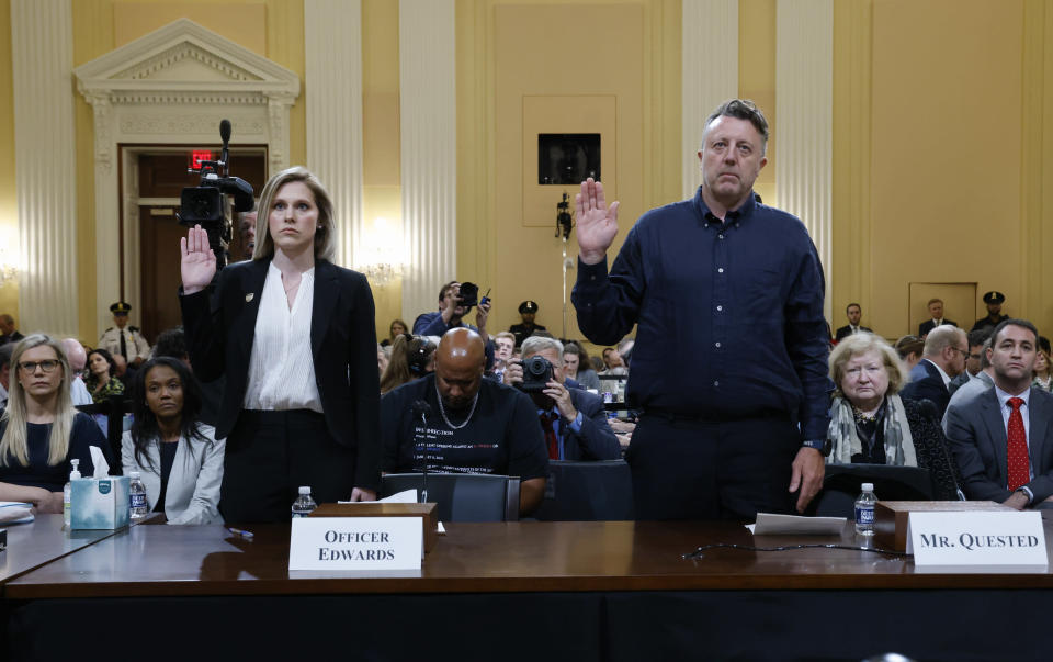 U.S. Capitol Police officer Caroline Edwards, left, and British filmmaker Nick Quested, are sworn in as the House select committee investigating the Jan. 6 attack on the U.S. Capitol holds its first public hearing to reveal the findings of a year-long investigation, on Capitol Hill in Washington, Thursday, June 9, 2022. (Jonathan Ernst/Pool via AP)