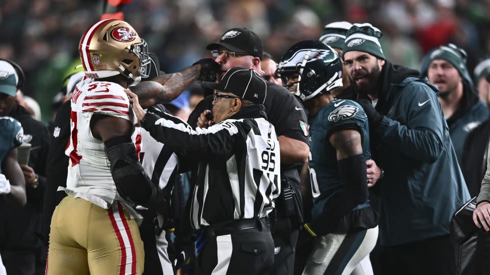 Dre Greenlaw and Eagles chief security officer Dom DiSandro face off. - Kyle Ross/Icon Sportswire/Getty Images