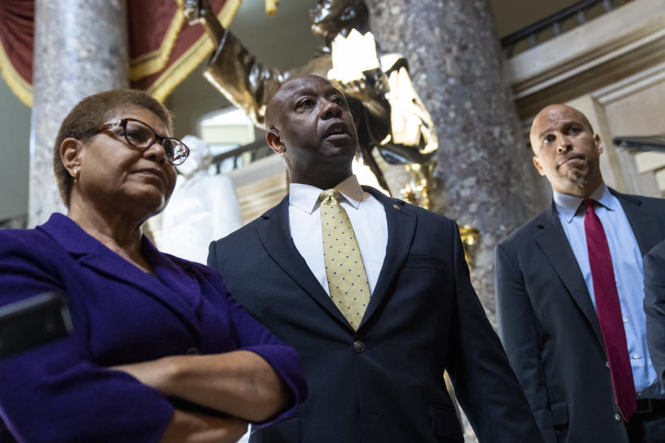 Rep. Karen Bass, Tim Scott, and Sen. Cory Booker.