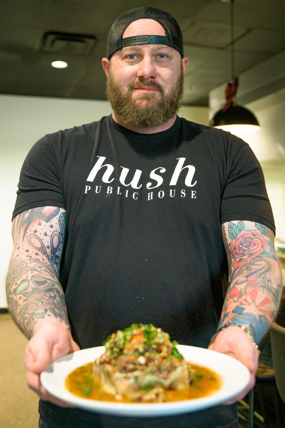 Owner and Chef Dom Ruggiero holding the Italian beef dish at Hush Public House in Scottsdale, Ariz. on Dec. 16, 2021.