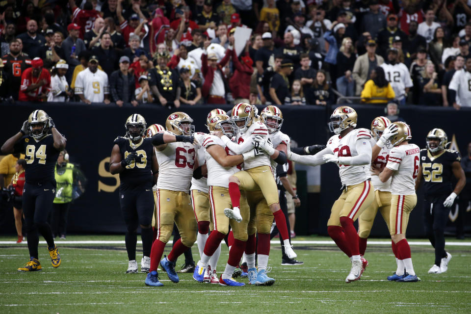 San Francisco 49ers kicker Robbie Gould (9) celebrates his game winning field goal with his team at the end of regulation in the second half an NFL football game against the New Orleans Saints in New Orleans, Sunday, Dec. 8, 2019. The 49ers won 48-46. (AP Photo/Butch Dill)