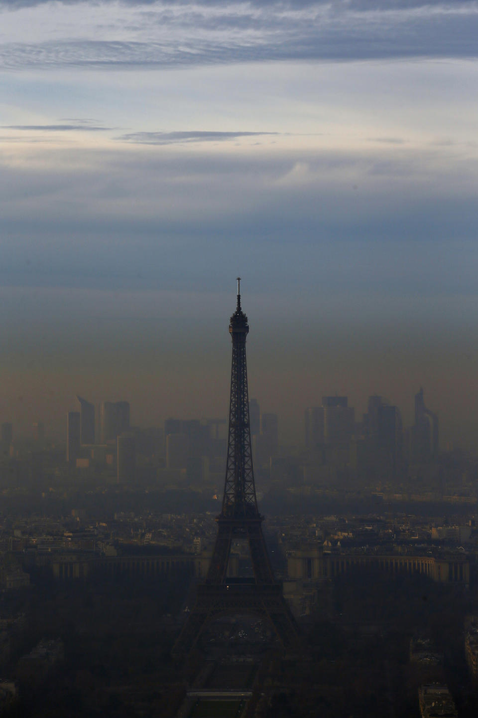 The Eiffel Tower is seen from the Montparnasse Tower, as Paris suffers a pollution spike, Dec. 7, 2016. Paris' Police authority is again cracking down on the city's rocketing air pollution with a 24-hour traffic-regulating scheme that aims to halve the day's emissions from road vehicles. (Photo: Francois Mori/AP)