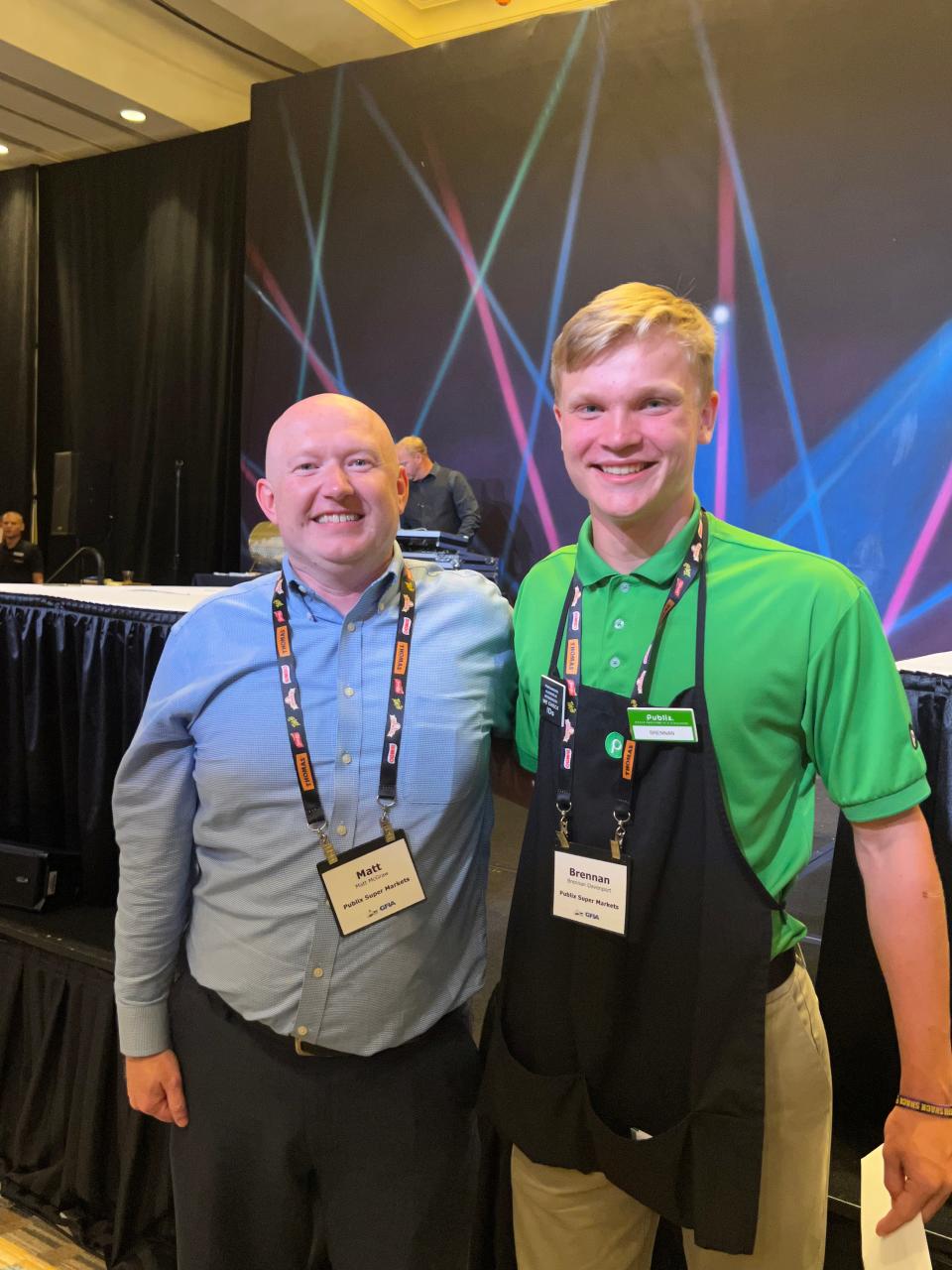 Publix cashier Brennan Davenport and store manager Matt McGraw. Davenport won Georgia grocery bagging competition, qualifying for nationals in Las Vegas.