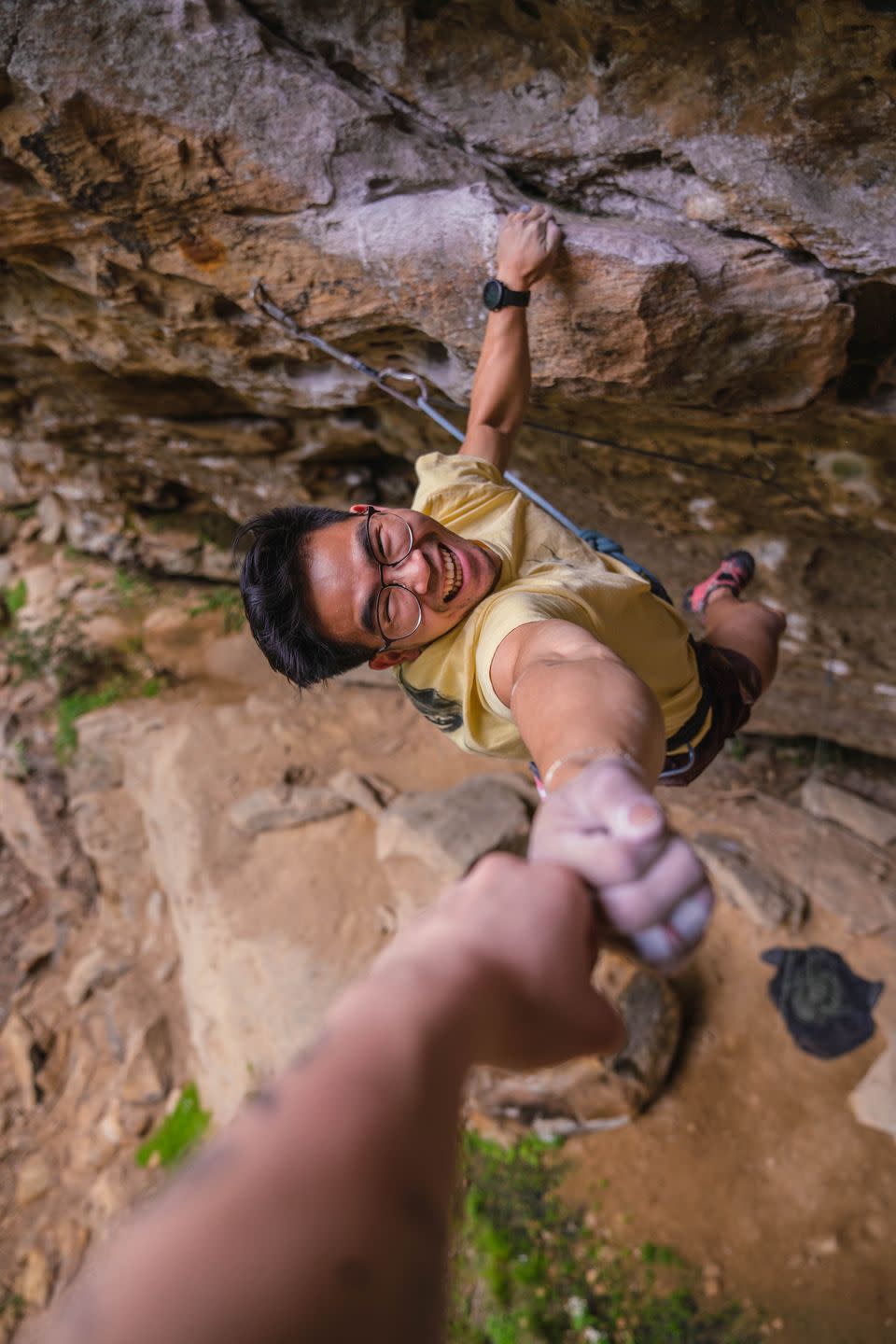 a man climbing a rock