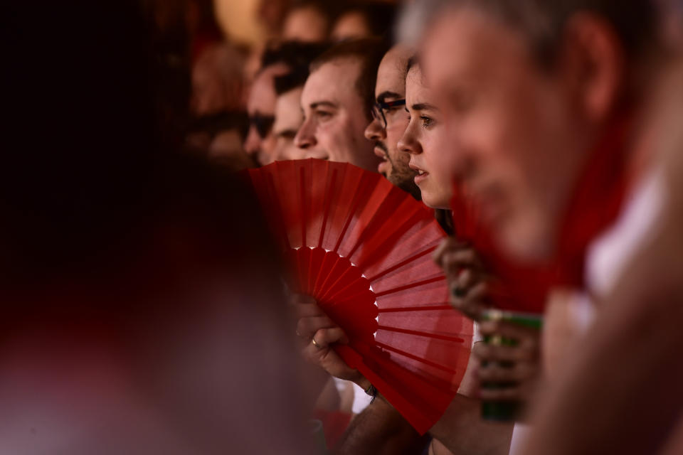 FILE- People attend a bullfight during the San Fermin festival in Pamplona, northern Spain, Thursday, July 7, 2022. (AP Photo/Alvaro Barrientos, File)