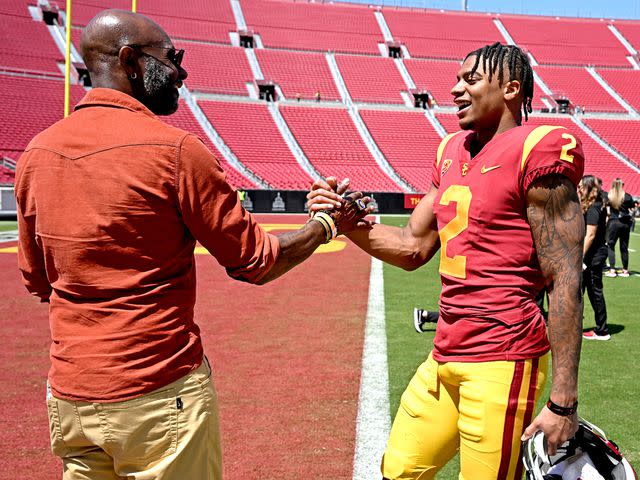 <p>Jayne Kamin-Oncea/Getty</p> Jerry Rice with his son, Brenden Rice of the USC Trojans, following the spring football game at the Los Angeles Memorial Coliseum on April 15, 2023