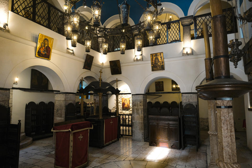 In this Wednesday, April 8, 2020 photo, the Old Orthodox Church in Sarajevo, Bosnia, is deserted due to the national lockdown the authorities have imposed attempting to limit the spread of the new coronavirus. (AP Photo/Kemal Softic)