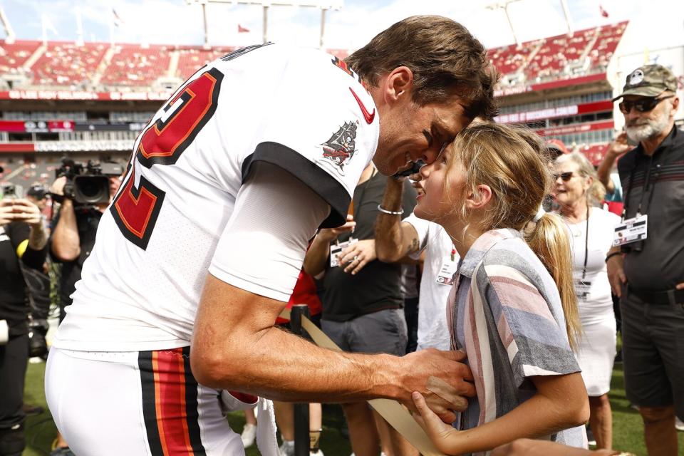 Tom Brady #12 of the Tampa Bay Buccaneers talks with his daughter Vivian on the sidelines prior to the game against the Green Bay Packers