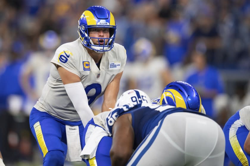 Los Angeles Rams quarterback Matthew Stafford (9) looks over the defense before the snap during an NFL football game against the Indianapolis Colts, Sunday, Sept. 19, 2021, in Indianapolis. (AP Photo/Zach Bolinger)