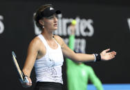 France's Kristina Mladenovic opens her arms after a shot to United States' Jessica Pegula during their match at the Australian Open tennis championships in Melbourne, Australia, Saturday, Feb. 13, 2021. (AP Photo/Hamish Blair)