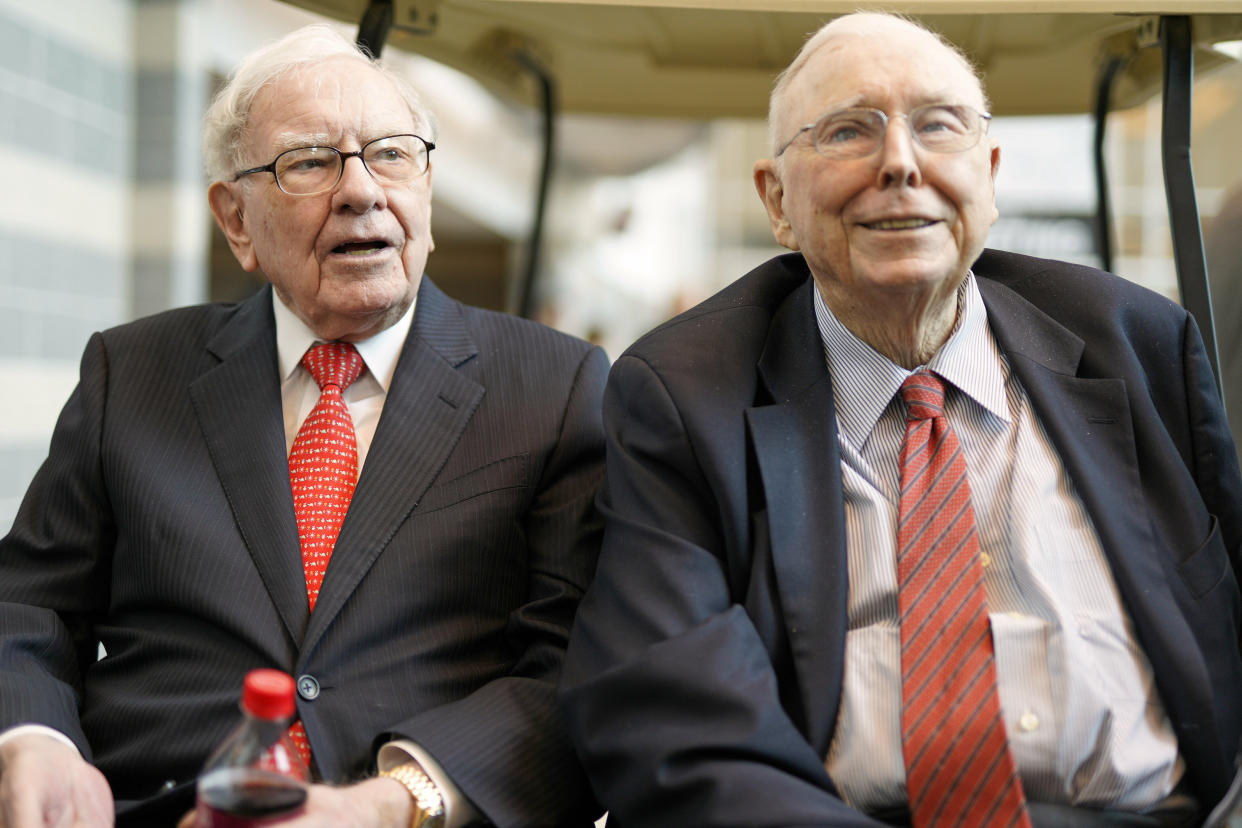 Berkshire Hathaway Chairman and CEO Warren Buffett, left, and Vice Chairman Charlie Munger, briefly chat with reporters Friday, May 3, 2019, one day before Berkshire Hathaway's annual shareholders meeting. An estimated 40,000 people are expected in town for the event, where Buffett and Munger preside over the meeting and spend hours answering questions. (AP Photo/Nati Harnik)